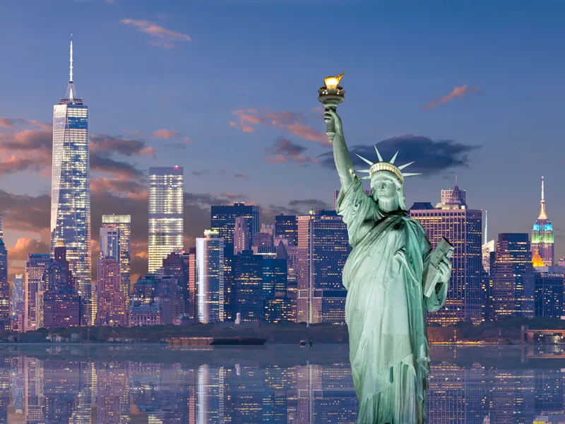 Statue of Liberty and World Trade Center at sunset, NYC